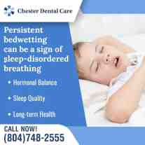 Child sleeping with mouth open, illustrating possible sleep-disordered breathing linked to persistent bedwetting.